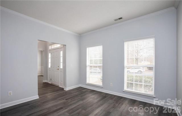815 Knightsbridge Road Fort Mill, SC 29708 - Photo 5 of 30 a view of an empty room with wooden floor and a window