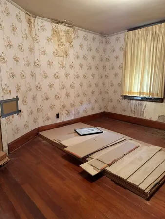 a living room with a bed