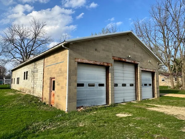 a view of a garage with parked cars
