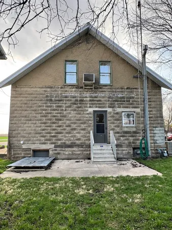 a front view of a house with garage