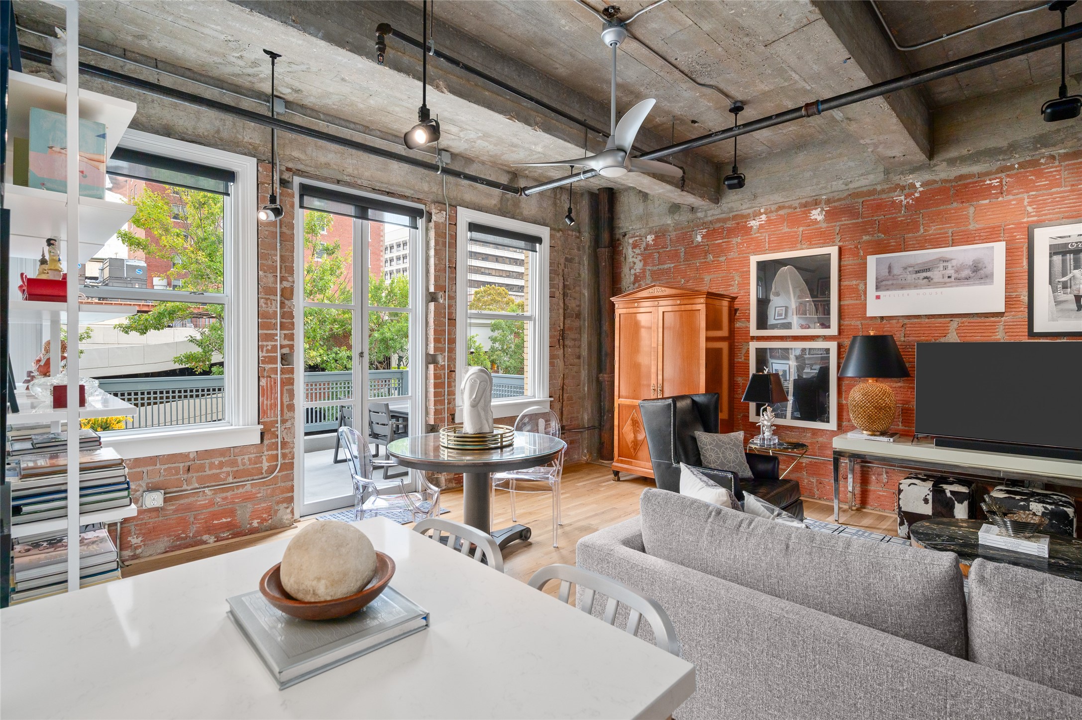 204 Travis Street, Unit 2C Houston, TX 77002 - Photo 11 of 28 a living room with furniture and a flat screen tv