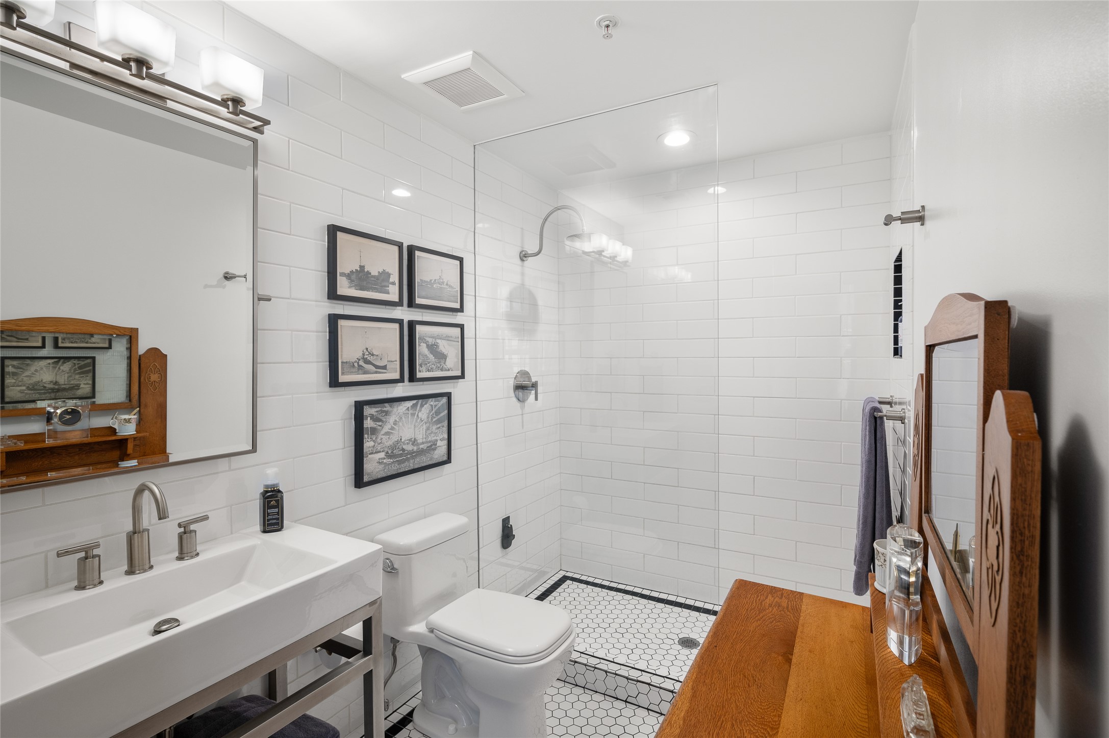 204 Travis Street, Unit 2C Houston, TX 77002 - Photo 15 of 28 a bathroom with a sink toilet and shower
