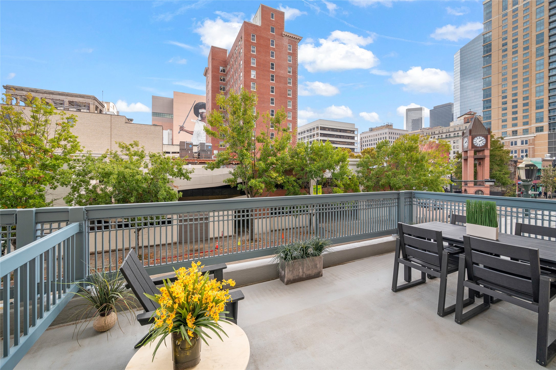 204 Travis Street, Unit 2C Houston, TX 77002 - Photo 17 of 28 a view of a terrace with chairs
