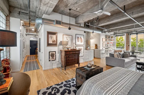 a bedroom with furniture and a fireplace
