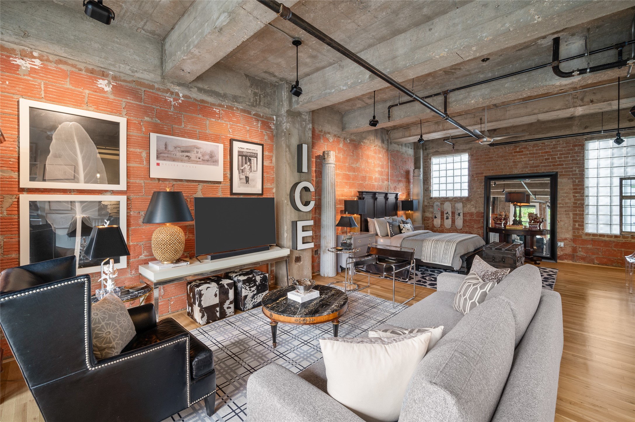 204 Travis Street, Unit 2C Houston, TX 77002 - Photo 8 of 28 a living room with furniture and a flat screen tv