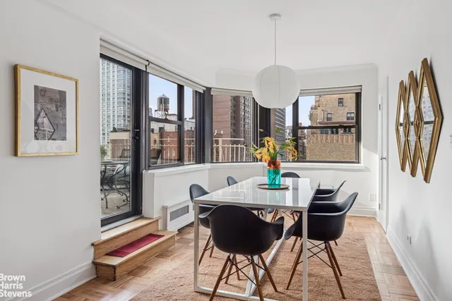 a dining room with furniture and window