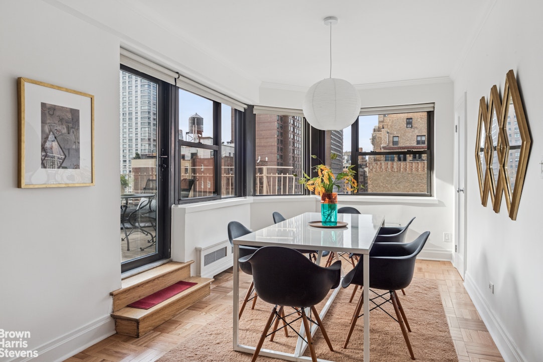 305 East 72nd Street, Unit PHC Manhattan, NY 10021 - Photo 2 of 9 a dining room with furniture and window