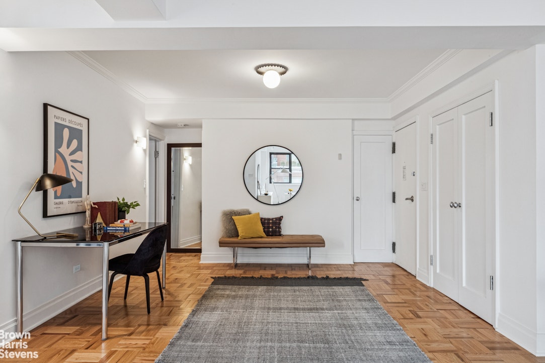 305 East 72nd Street, Unit PHC Manhattan, NY 10021 - Photo 3 of 9 a living room with couch chairs and a large mirror next to a window