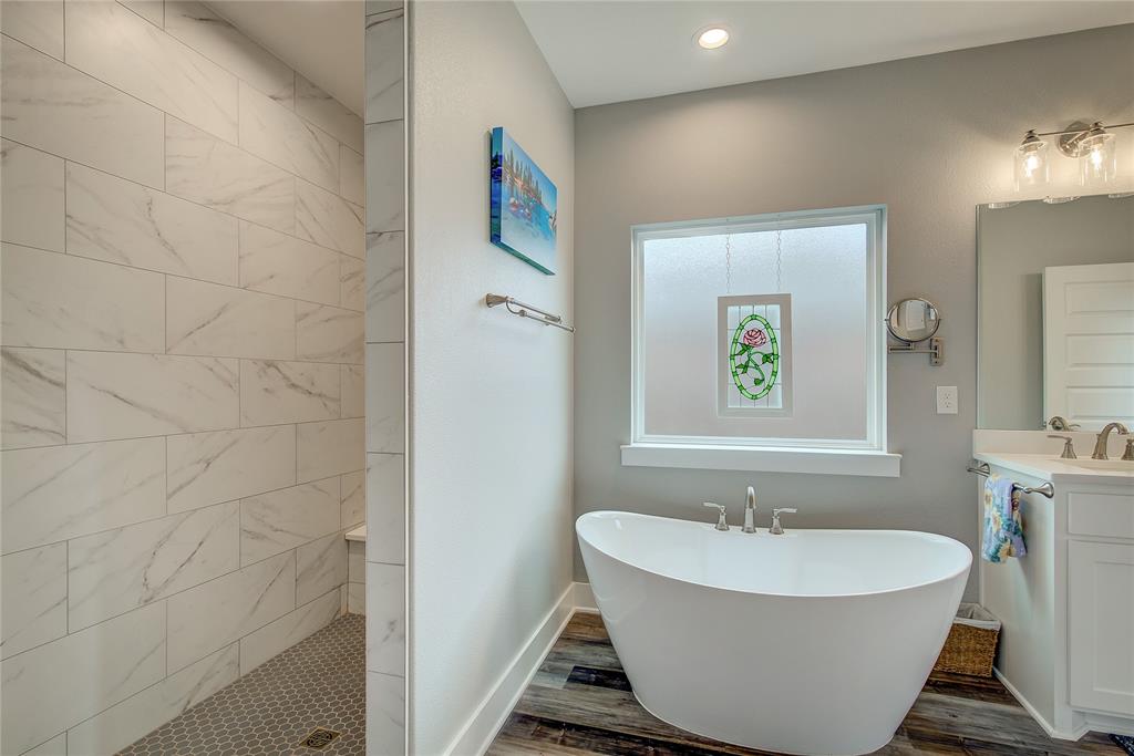326 Koby Circle Sulphur Springs, TX 75482 - Photo 25 of 38 deep walk-in tiled shower with bench.