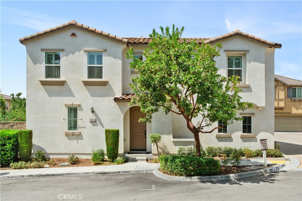 front view of a house with a street