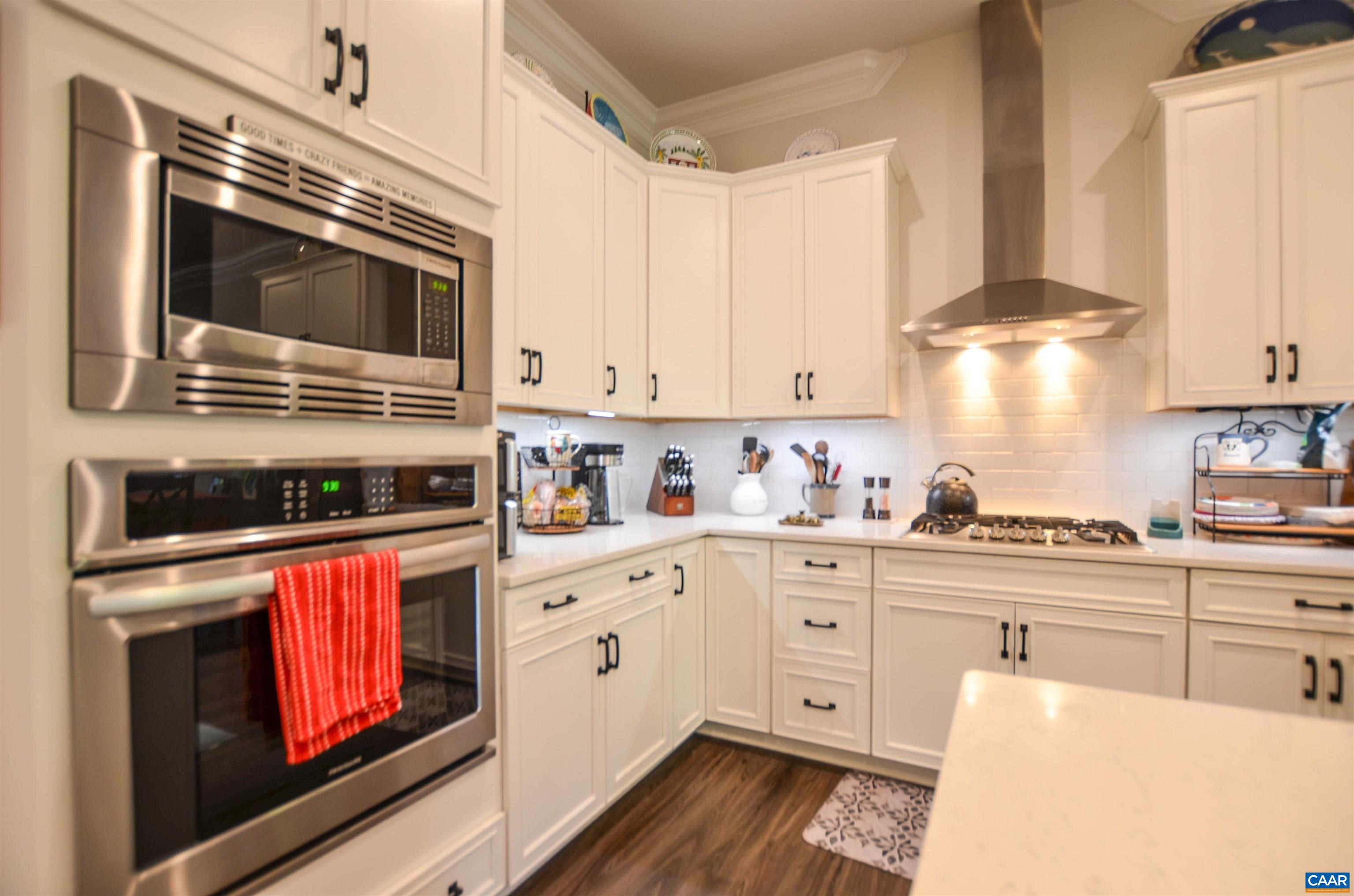 327 Claibourne Road Crozet, VA 22932 - Photo 11 of 36 a kitchen with stainless steel appliances granite countertop a stove and a microwave