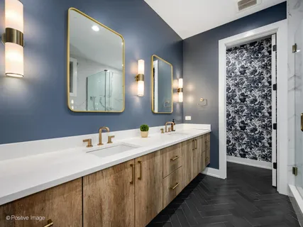 a bathroom with a double vanity sink and a mirror