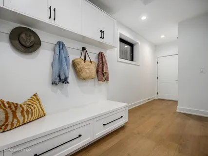 a view of room with furniture and wooden floor