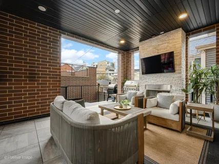 a living room with fireplace furniture and a flat screen tv