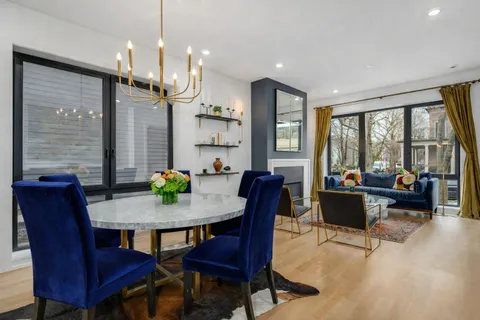 a view of a dining room with furniture window and outside view