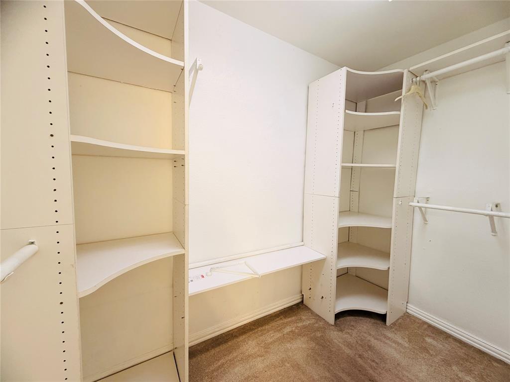 434 Moonlight Way Irving, TX 75063 - Photo 12 of 29 a view of an empty walk in closet