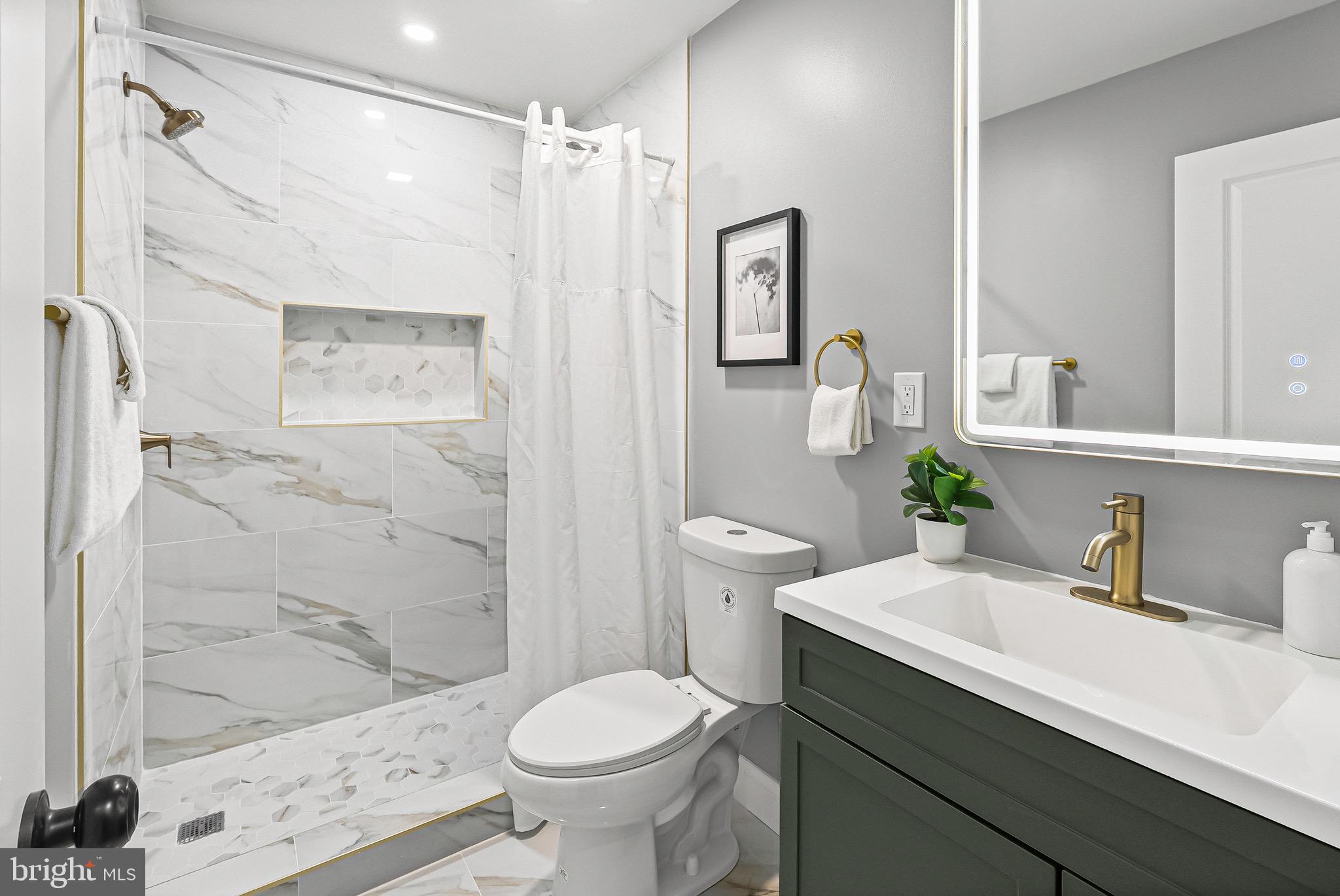 1600 Federal Street Baltimore, MD 21213 - Photo 15 of 31 a bathroom with a sink toilet and shower