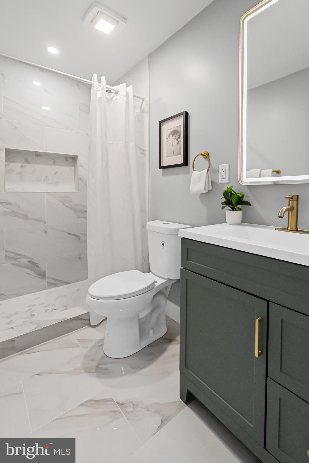 1600 Federal Street Baltimore, MD 21213 - Photo 16 of 31 a bathroom with a sink toilet and shower