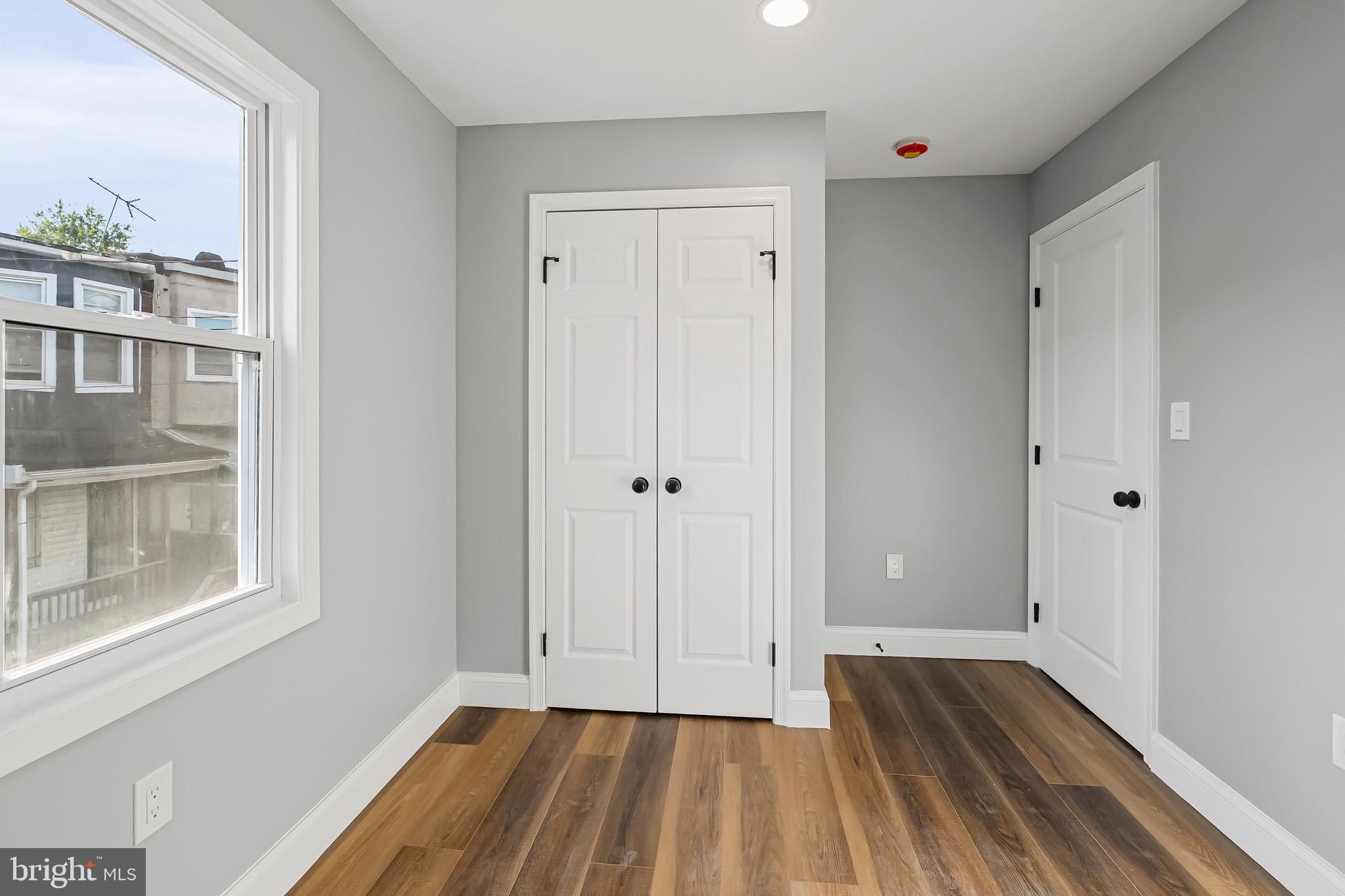 1600 Federal Street Baltimore, MD 21213 - Photo 18 of 31 a view of a room with wooden floor and a window