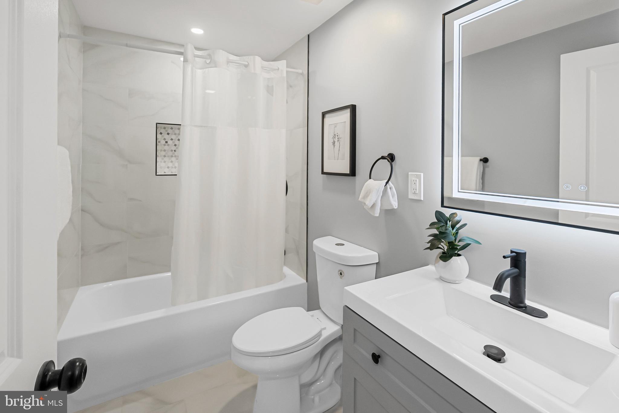 1600 Federal Street Baltimore, MD 21213 - Photo 19 of 31 a bathroom with a sink toilet and shower