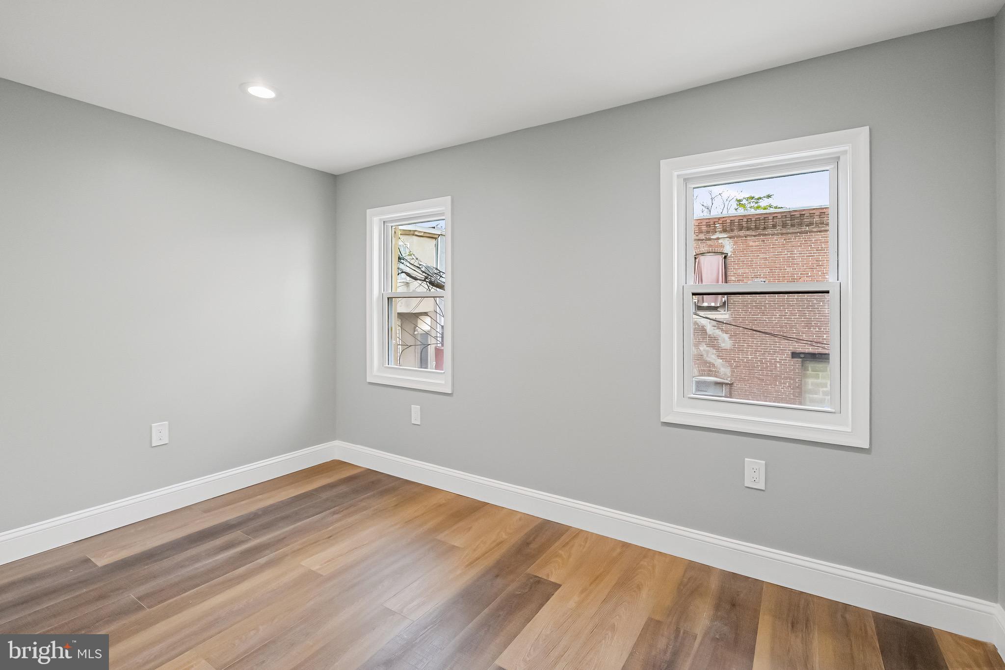 1600 Federal Street Baltimore, MD 21213 - Photo 21 of 31 wooden floor in an empty room with a window