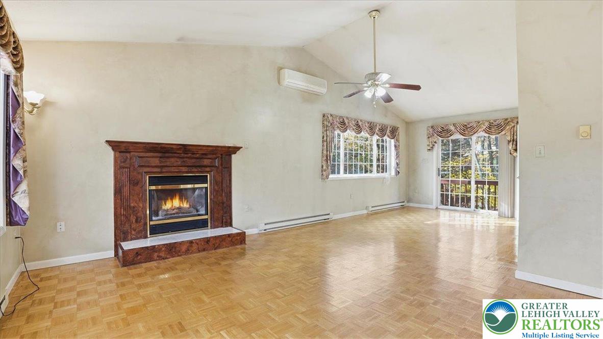 349 Bumble Bee Pass Cresco, PA 18326 - Photo 11 of 92 a view of an empty room with a fireplace and a window