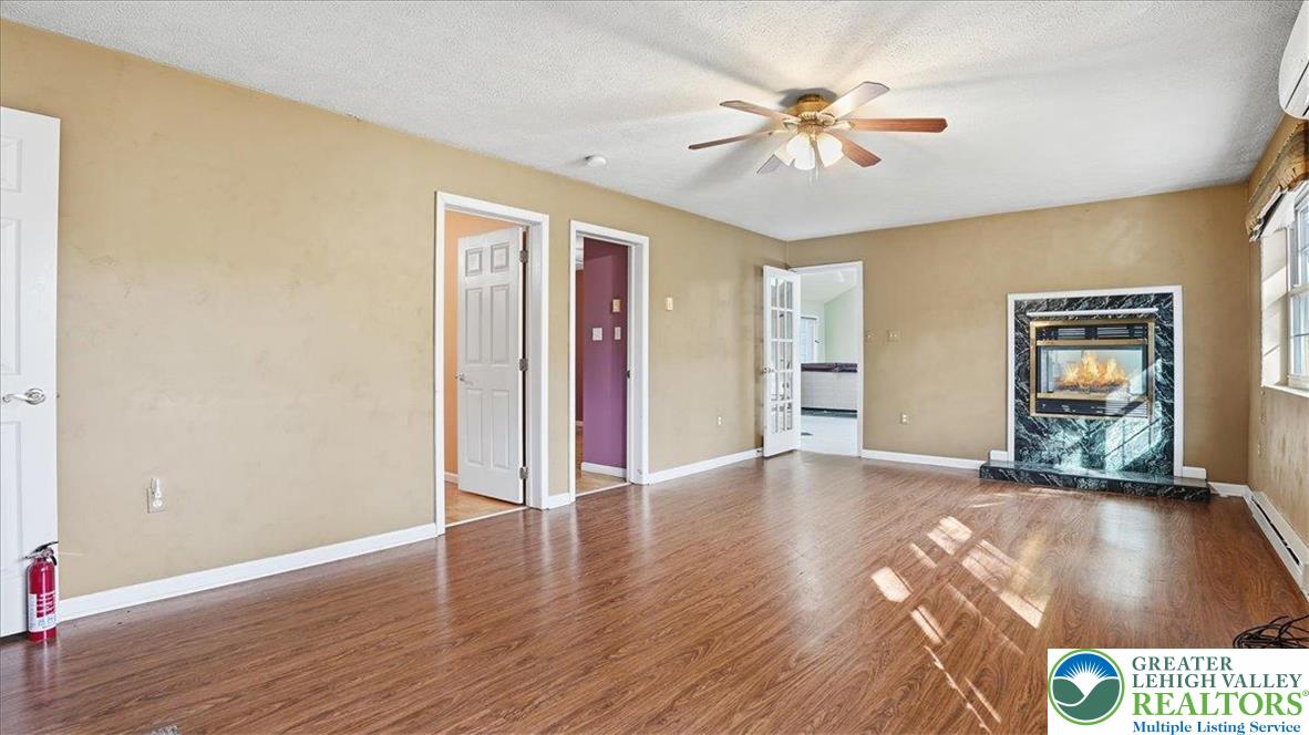 349 Bumble Bee Pass Cresco, PA 18326 - Photo 18 of 92 a view of an empty room with window and wooden floor