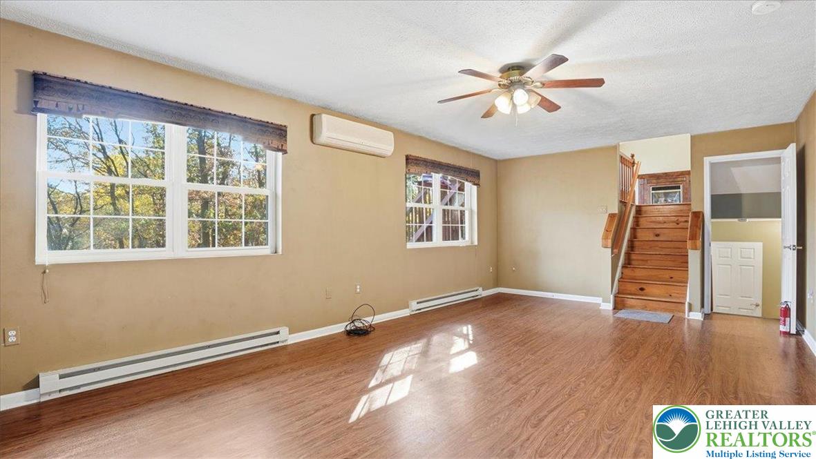 349 Bumble Bee Pass Cresco, PA 18326 - Photo 20 of 92 a view of an empty room with wooden floor and a window