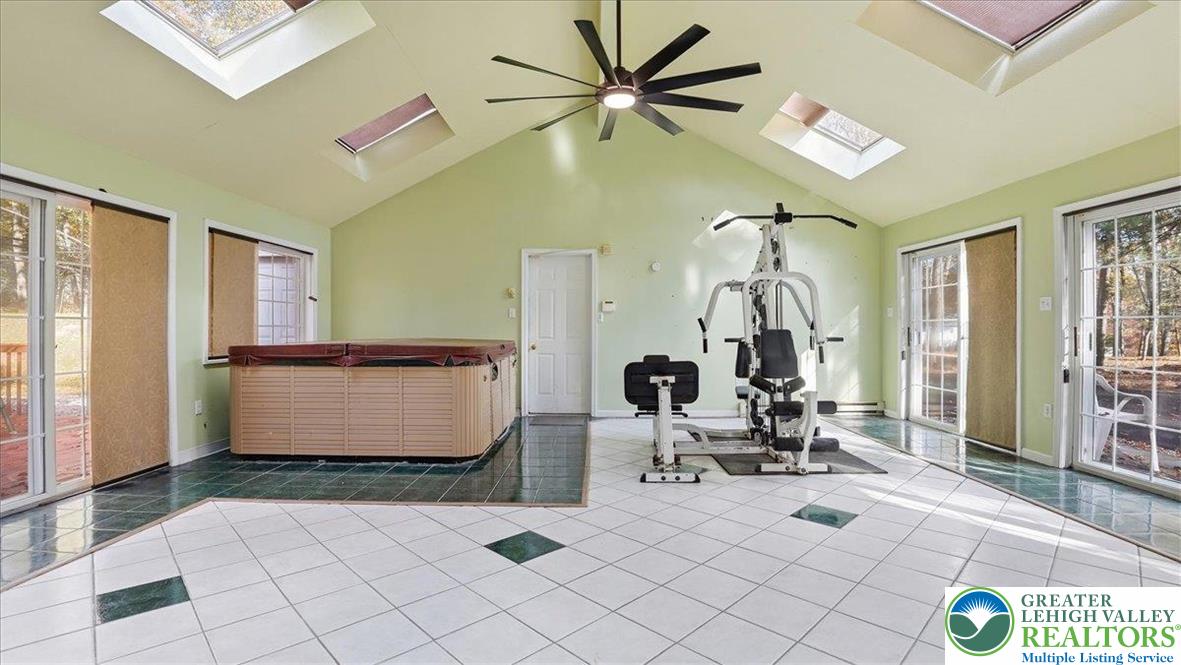 349 Bumble Bee Pass Cresco, PA 18326 - Photo 27 of 92 a room with gym equipment and view of living room