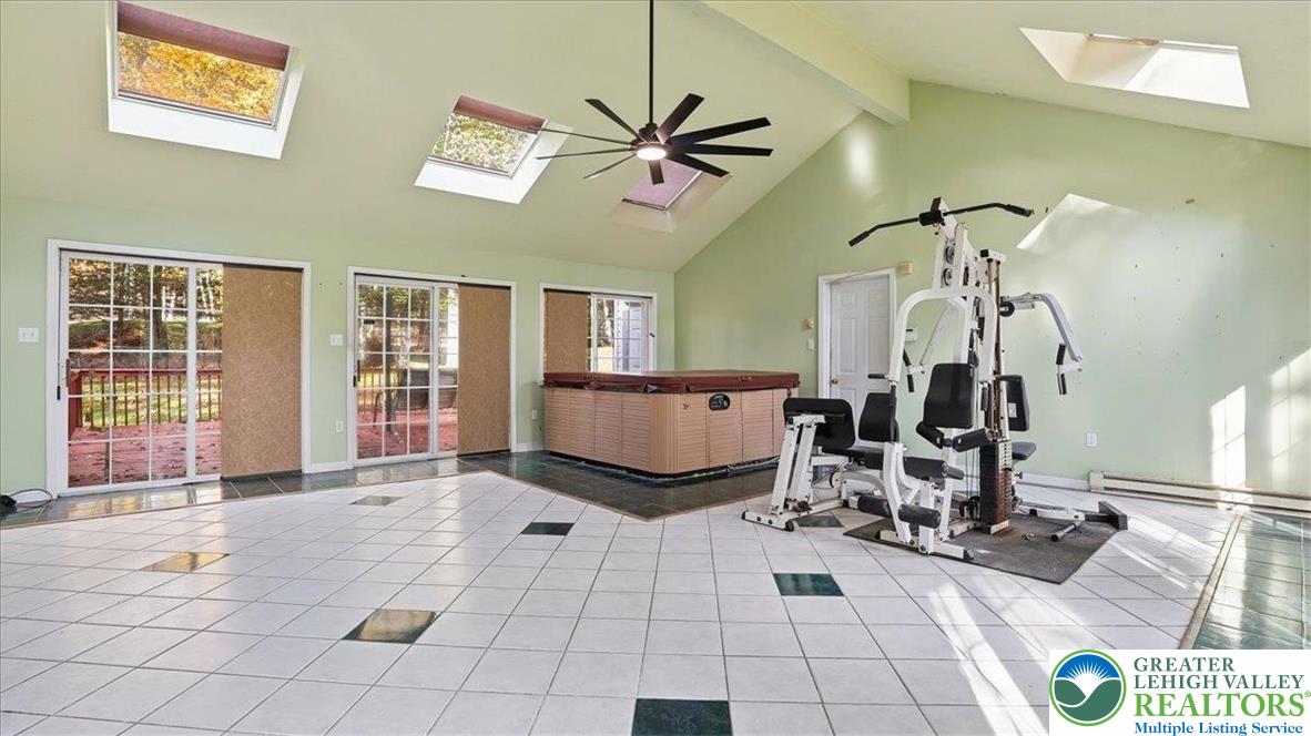 349 Bumble Bee Pass Cresco, PA 18326 - Photo 29 of 92 a living room with hard wood flooring and a glass door