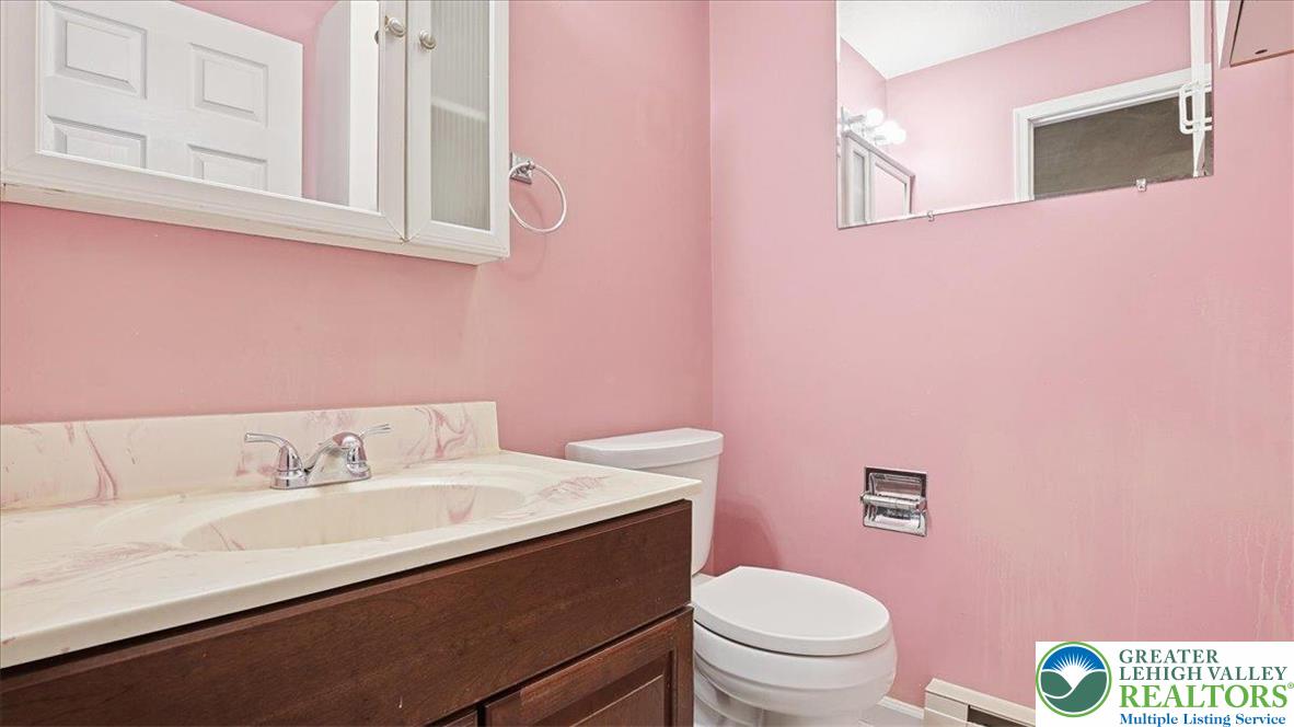 349 Bumble Bee Pass Cresco, PA 18326 - Photo 33 of 92 a bathroom with a sink a toilet and a mirror