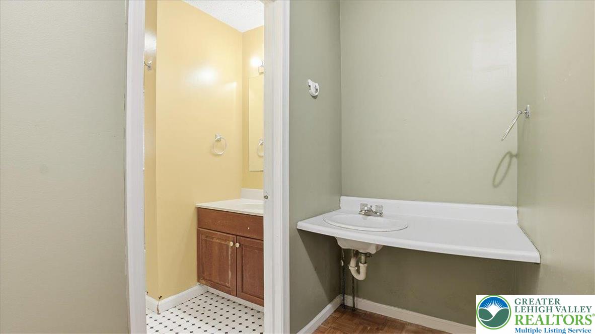 349 Bumble Bee Pass Cresco, PA 18326 - Photo 42 of 92 a bathroom with a sink a toilet and a mirror
