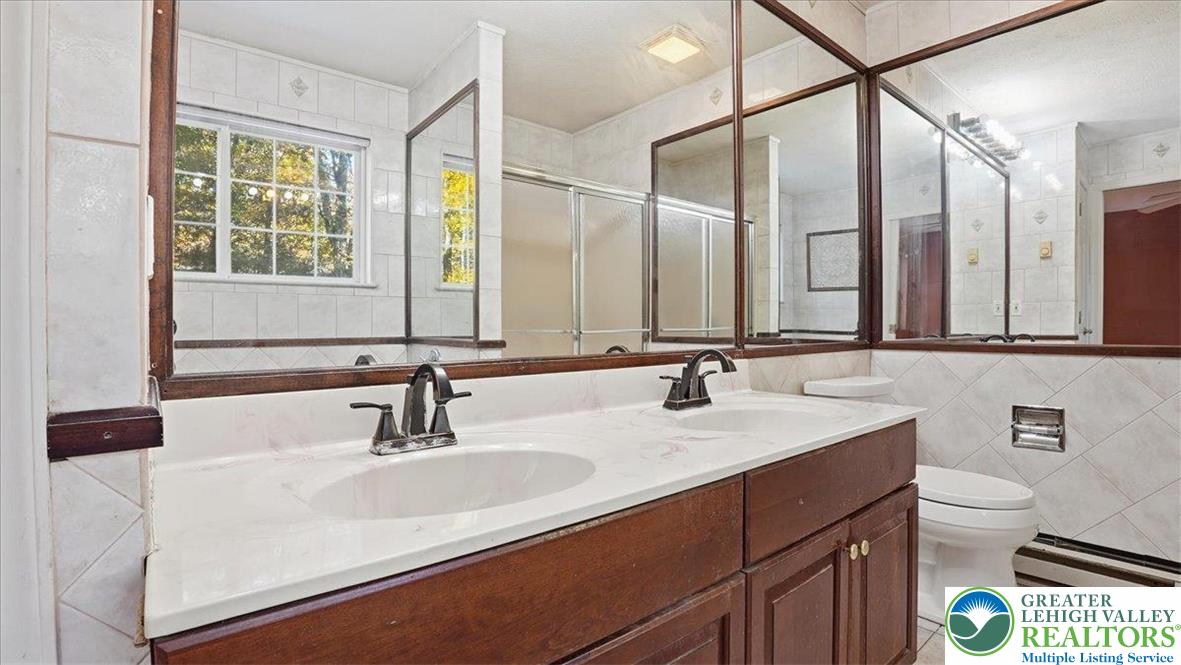 349 Bumble Bee Pass Cresco, PA 18326 - Photo 46 of 92 a bathroom with a sink and a mirror