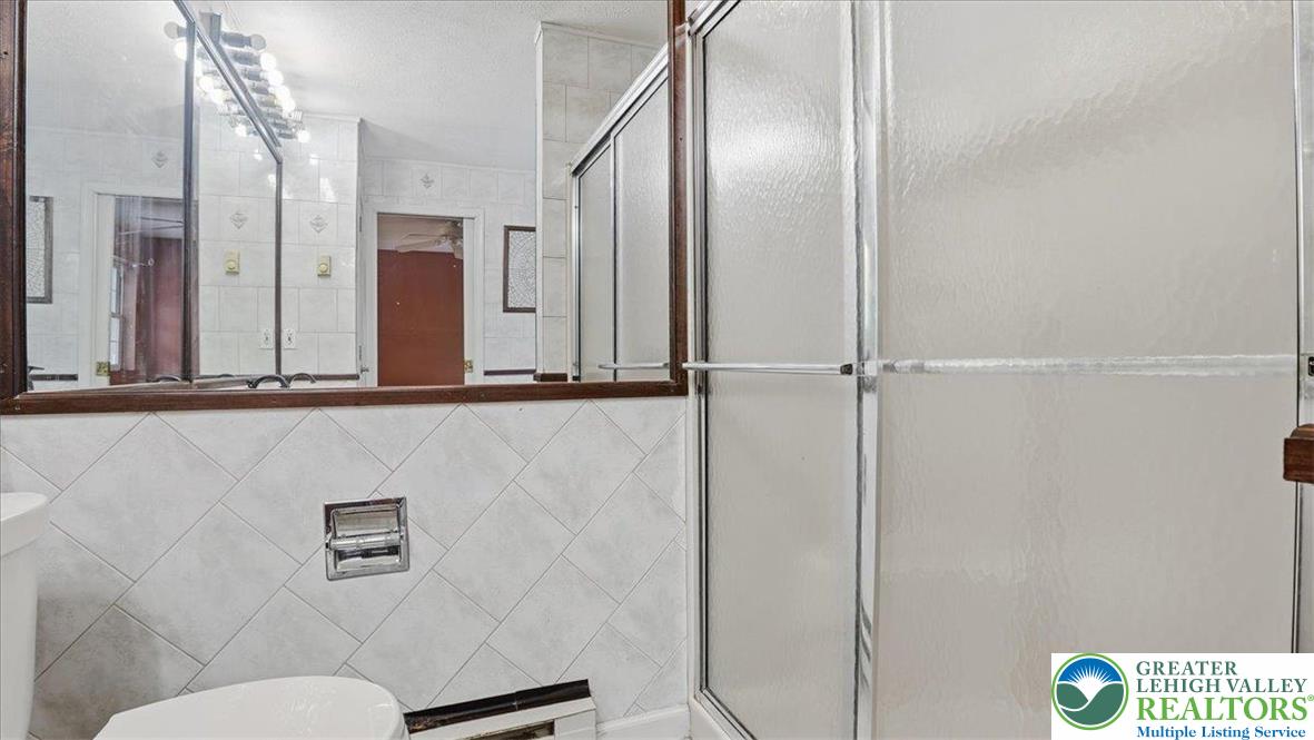 349 Bumble Bee Pass Cresco, PA 18326 - Photo 48 of 92 a bathroom with a sink and a mirror