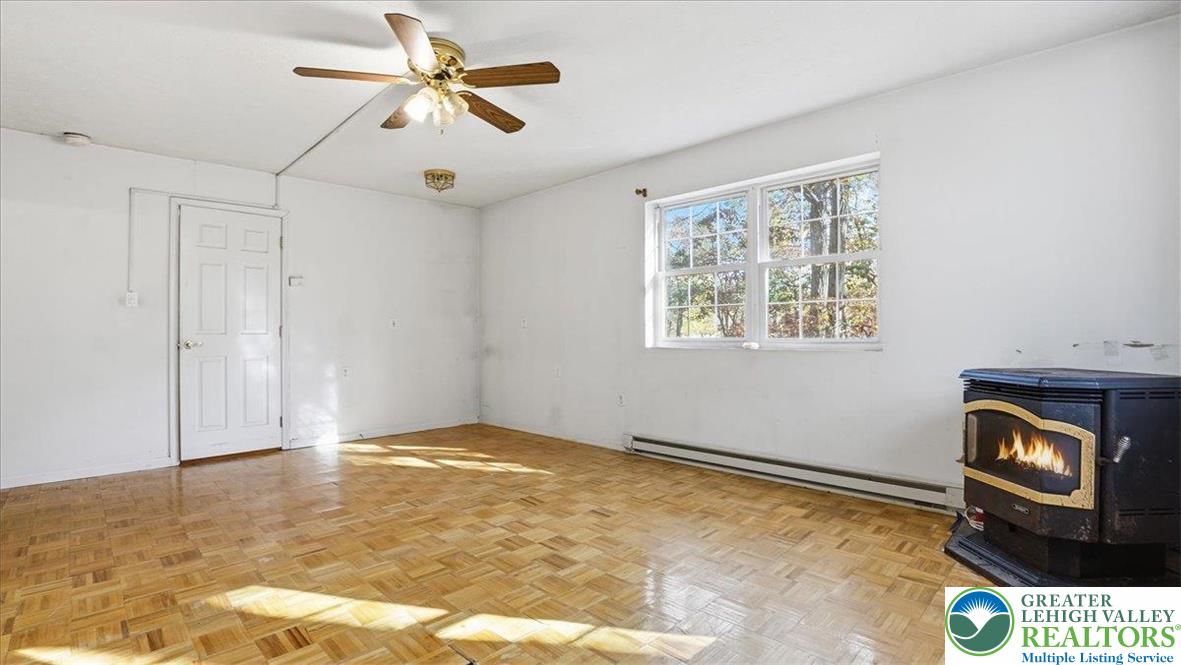 349 Bumble Bee Pass Cresco, PA 18326 - Photo 49 of 92 a view of an empty room and window with chandelier fan