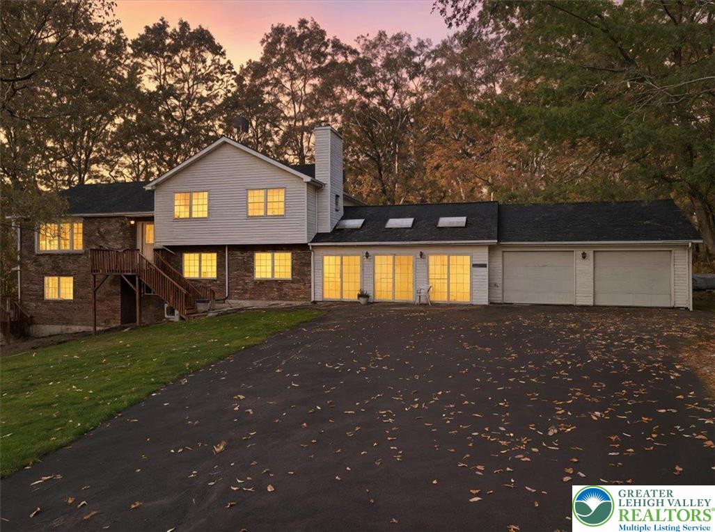 349 Bumble Bee Pass Cresco, PA 18326 - Photo 5 of 92 a view of a brick house with a yard