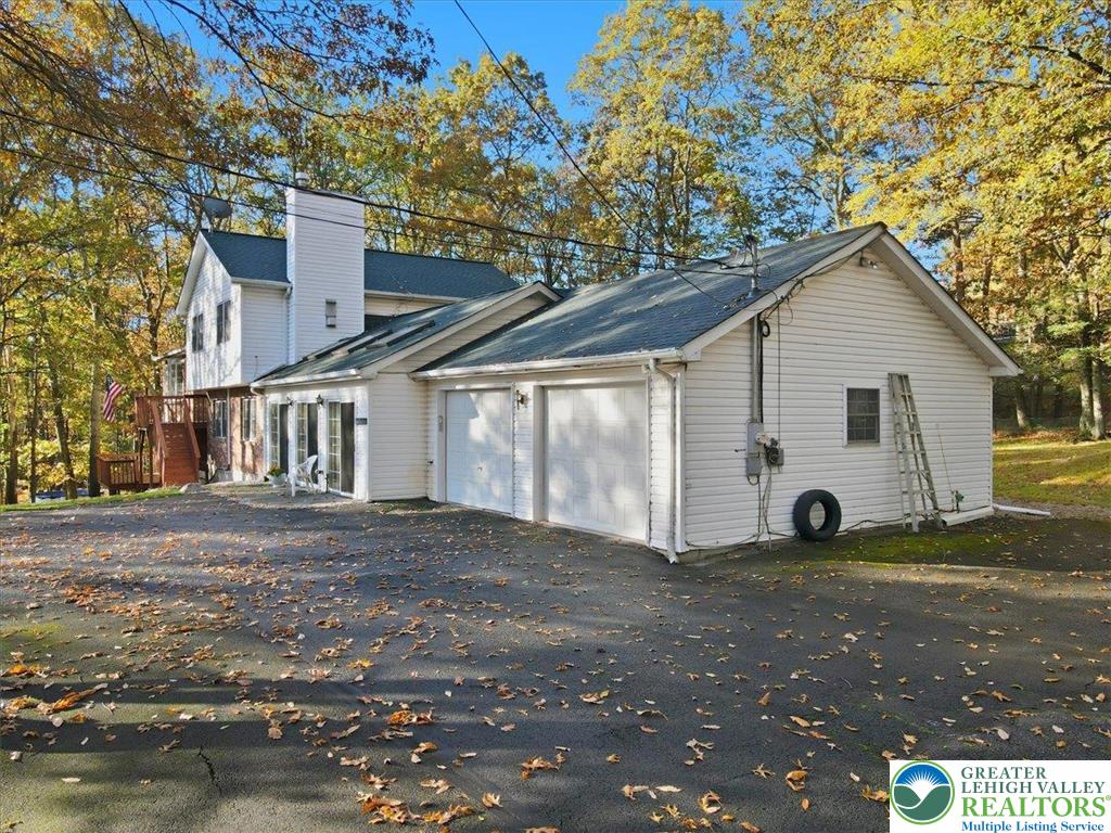 349 Bumble Bee Pass Cresco, PA 18326 - Photo 59 of 92 a view of a yard in front of a house with a large tree