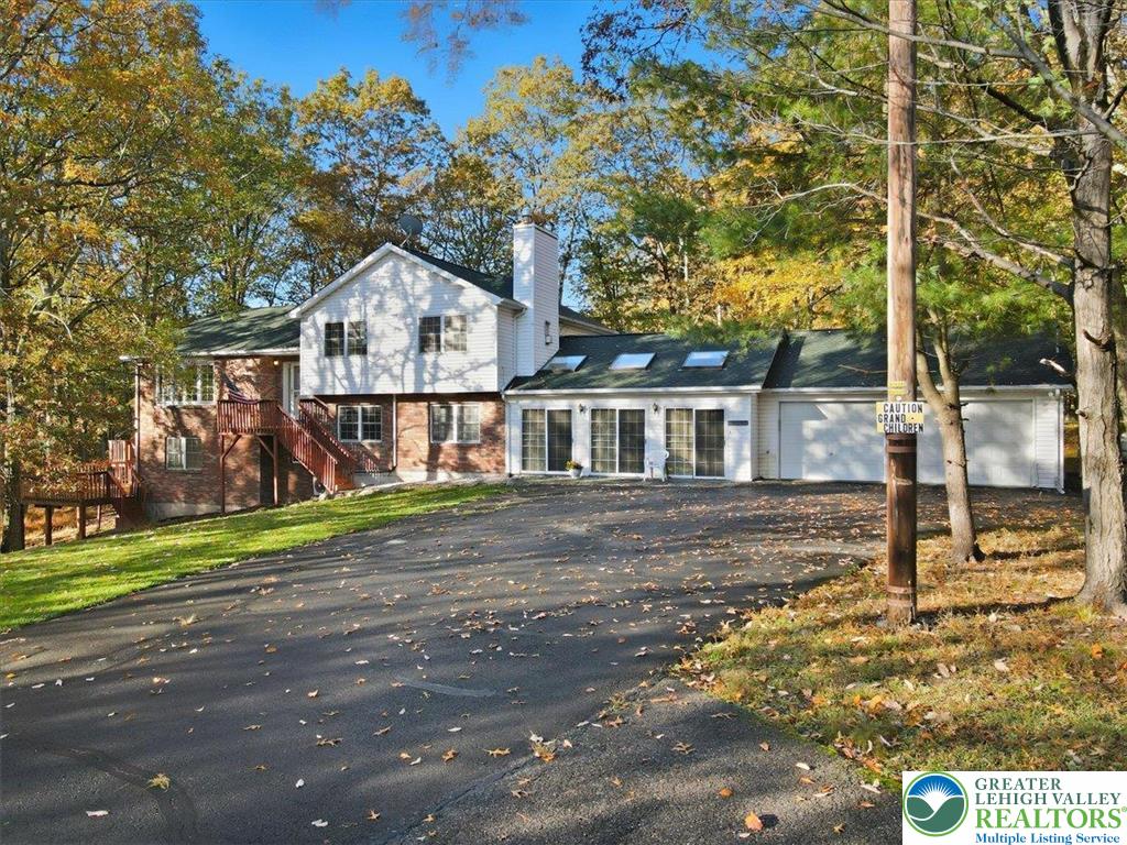 349 Bumble Bee Pass Cresco, PA 18326 - Photo 6 of 92 a front view of a house with a yard