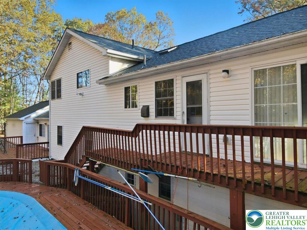 349 Bumble Bee Pass Cresco, PA 18326 - Photo 69 of 92 a view of a roof deck with wooden floor and fence