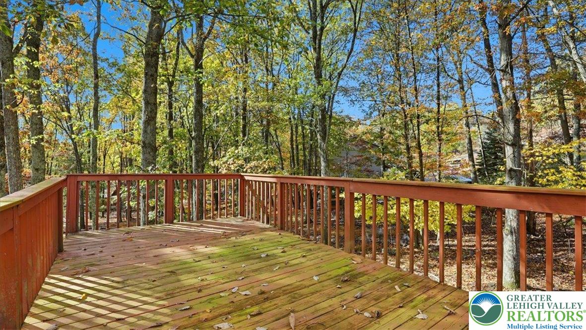 349 Bumble Bee Pass Cresco, PA 18326 - Photo 79 of 92 a balcony with wooden floor and fence