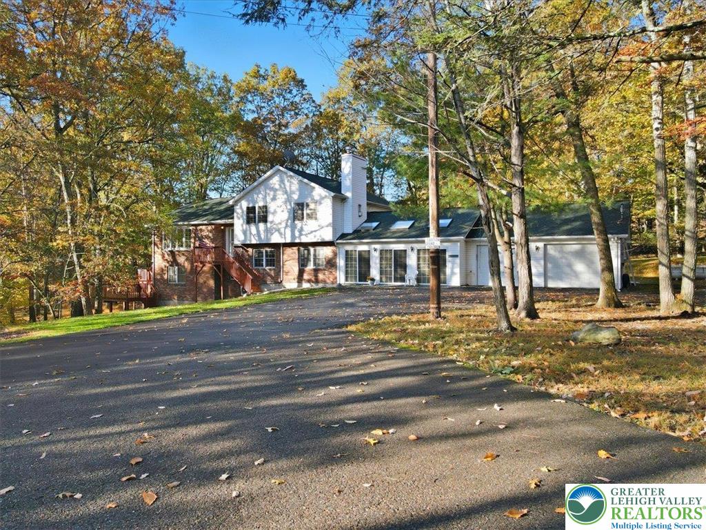 349 Bumble Bee Pass Cresco, PA 18326 - Photo 80 of 92 a front view of a house with a garden