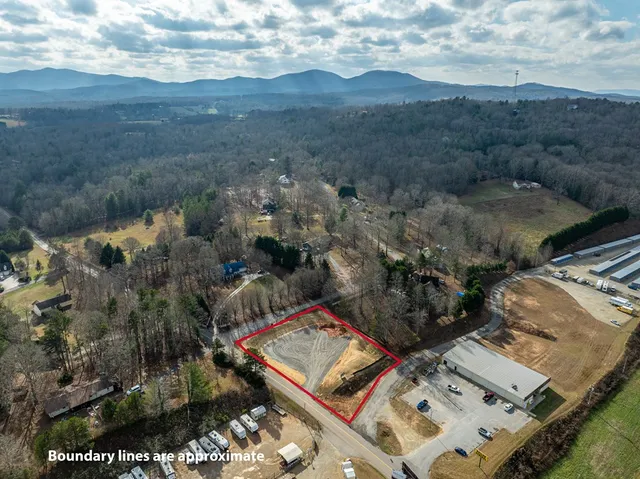 a view of a wooden house with a yard