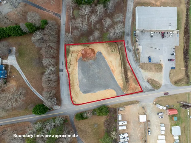 a view of building with swimming pool and mountains in the background