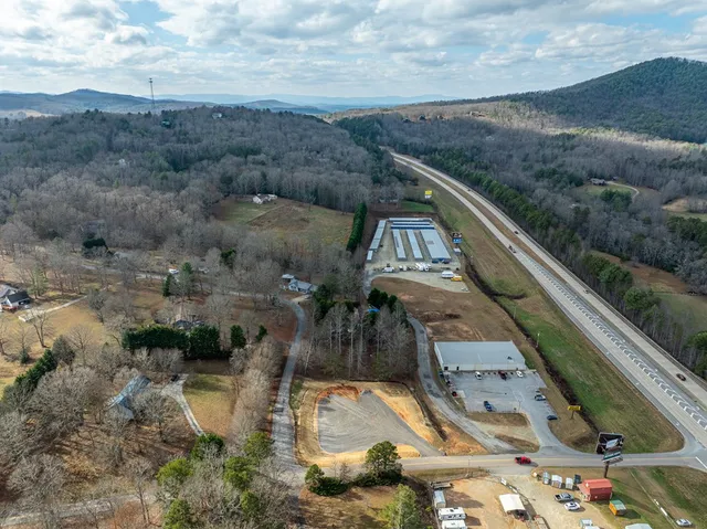 a view of a swimming pool with a yard