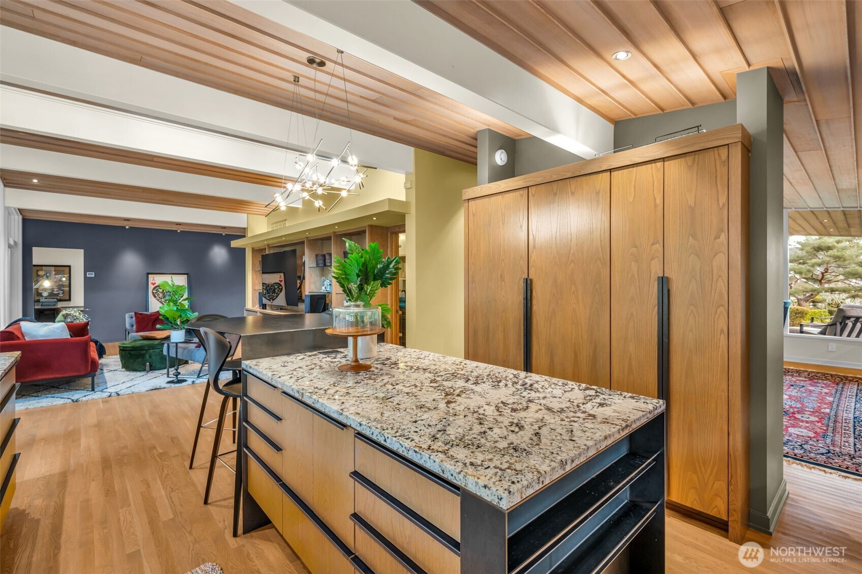 6437 Hampton Road South Seattle, WA 98118 - Photo 13 of 39 a view of kitchen island wooden floor and living room