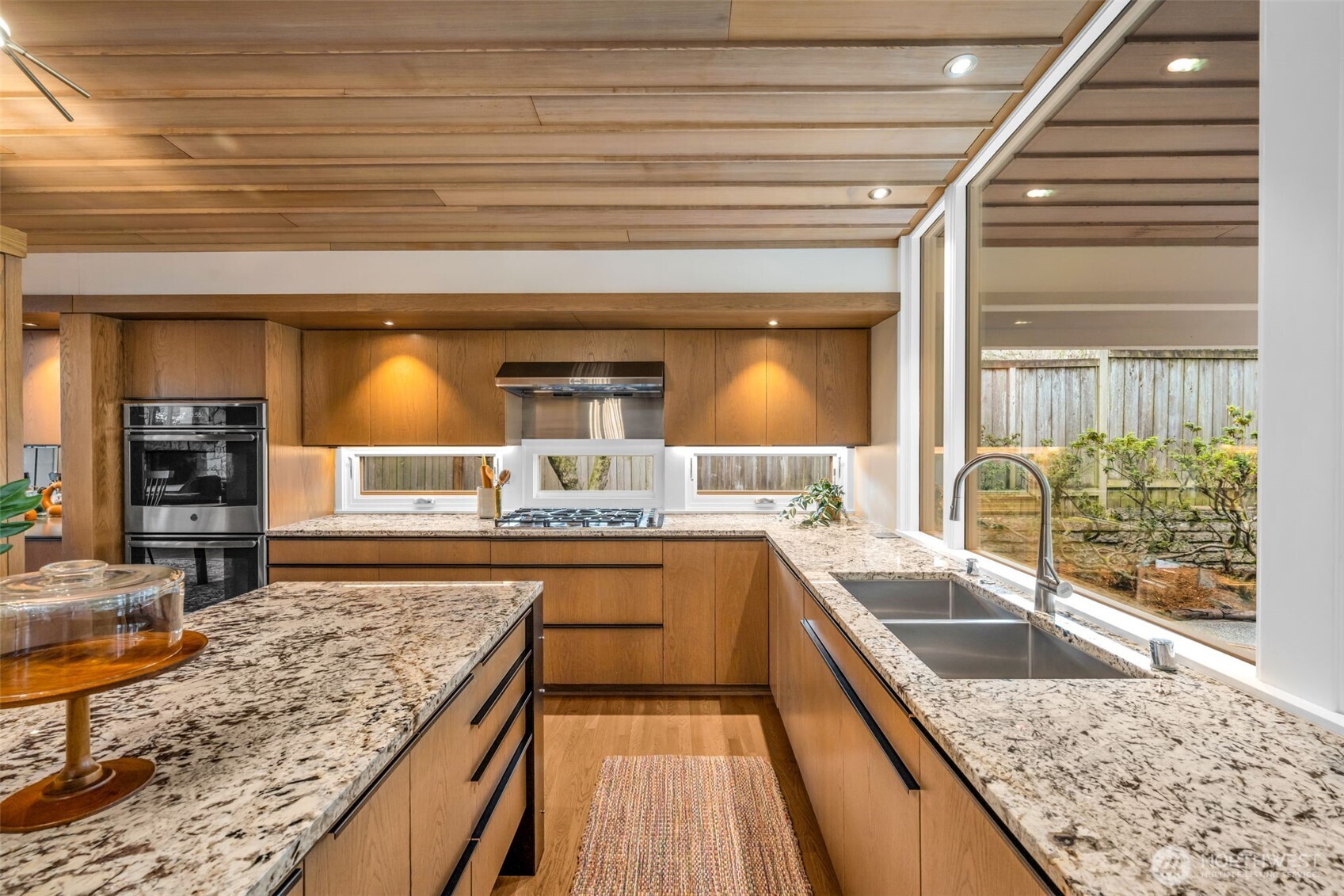 6437 Hampton Road South Seattle, WA 98118 - Photo 15 of 39 a bathroom with a granite countertop sink and mirror