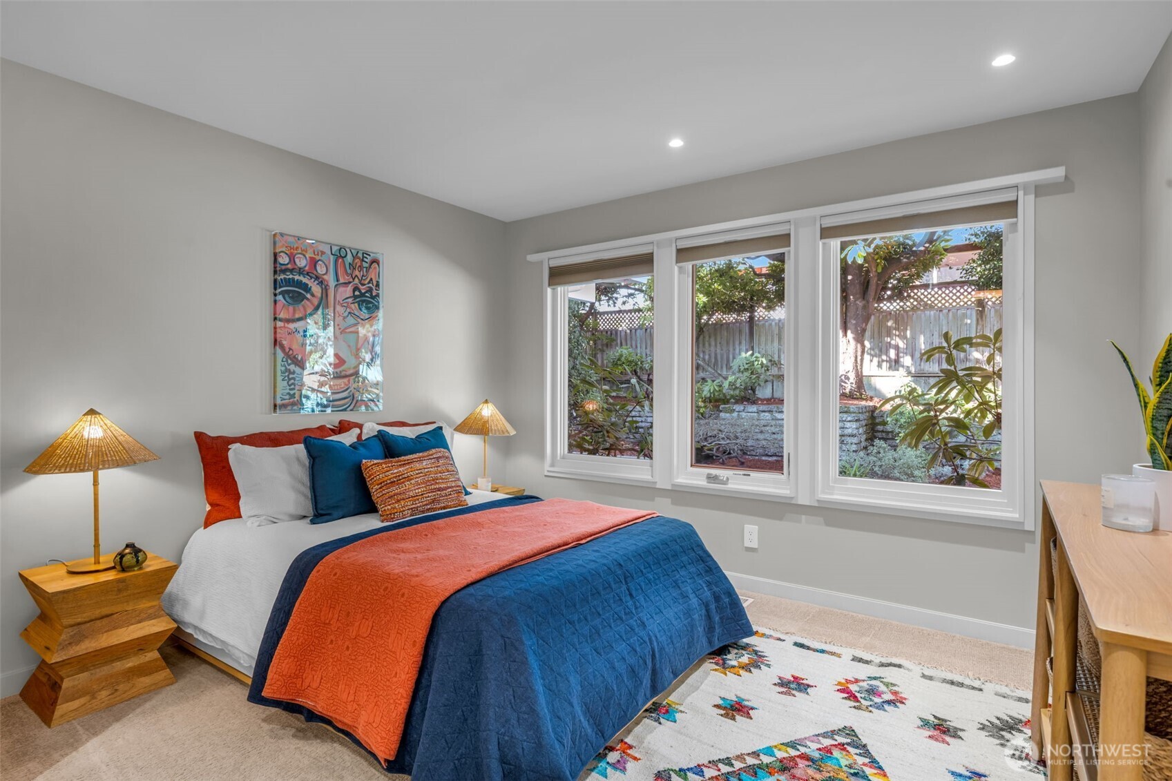 6437 Hampton Road South Seattle, WA 98118 - Photo 20 of 39 a bed sitting in a bedroom next to a window