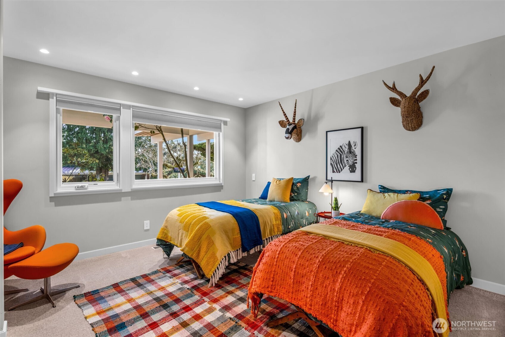 6437 Hampton Road South Seattle, WA 98118 - Photo 21 of 39 a bedroom with two beds and a window
