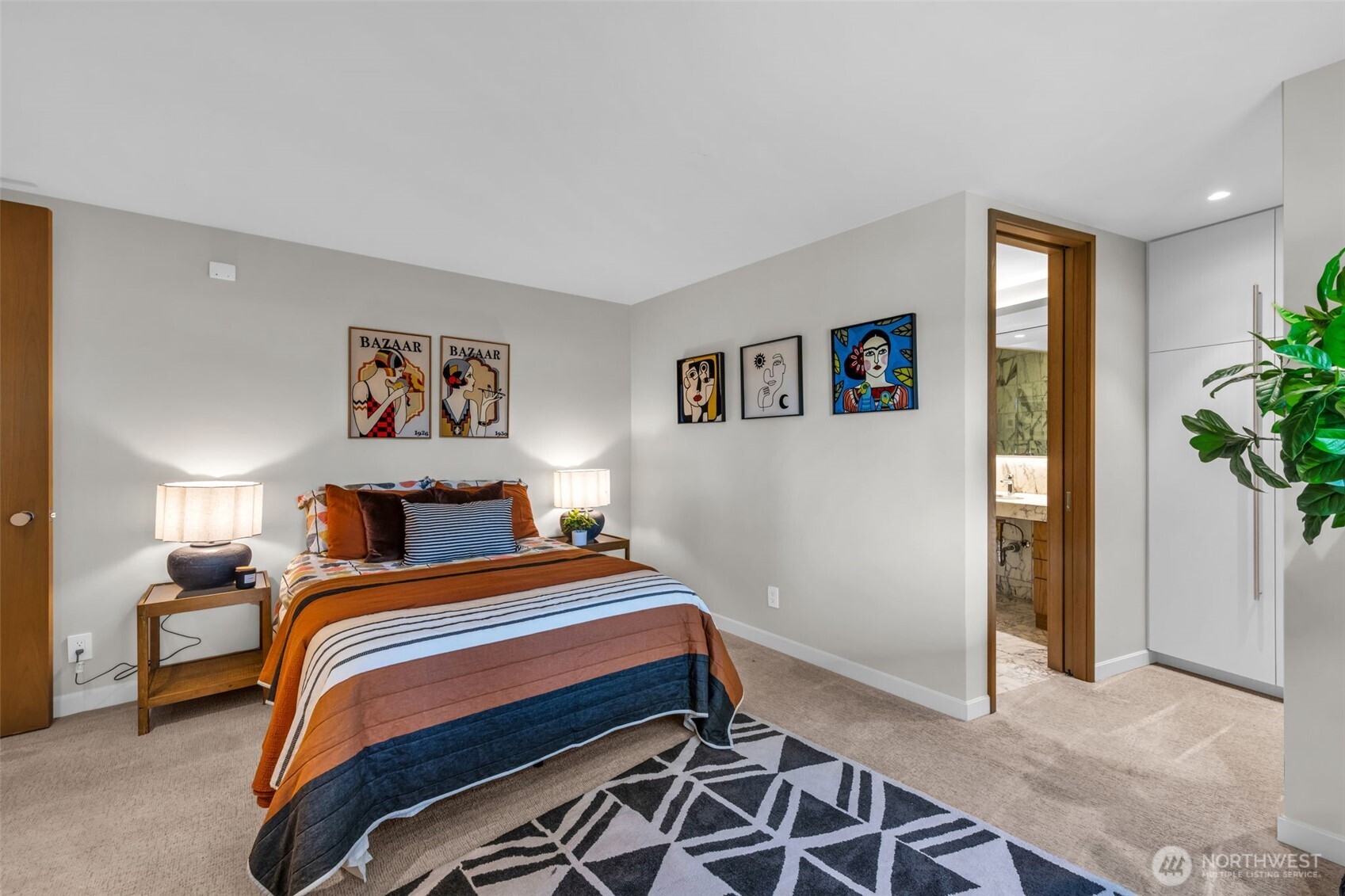 6437 Hampton Road South Seattle, WA 98118 - Photo 23 of 39 a bedroom with a bed and a painting on the wall