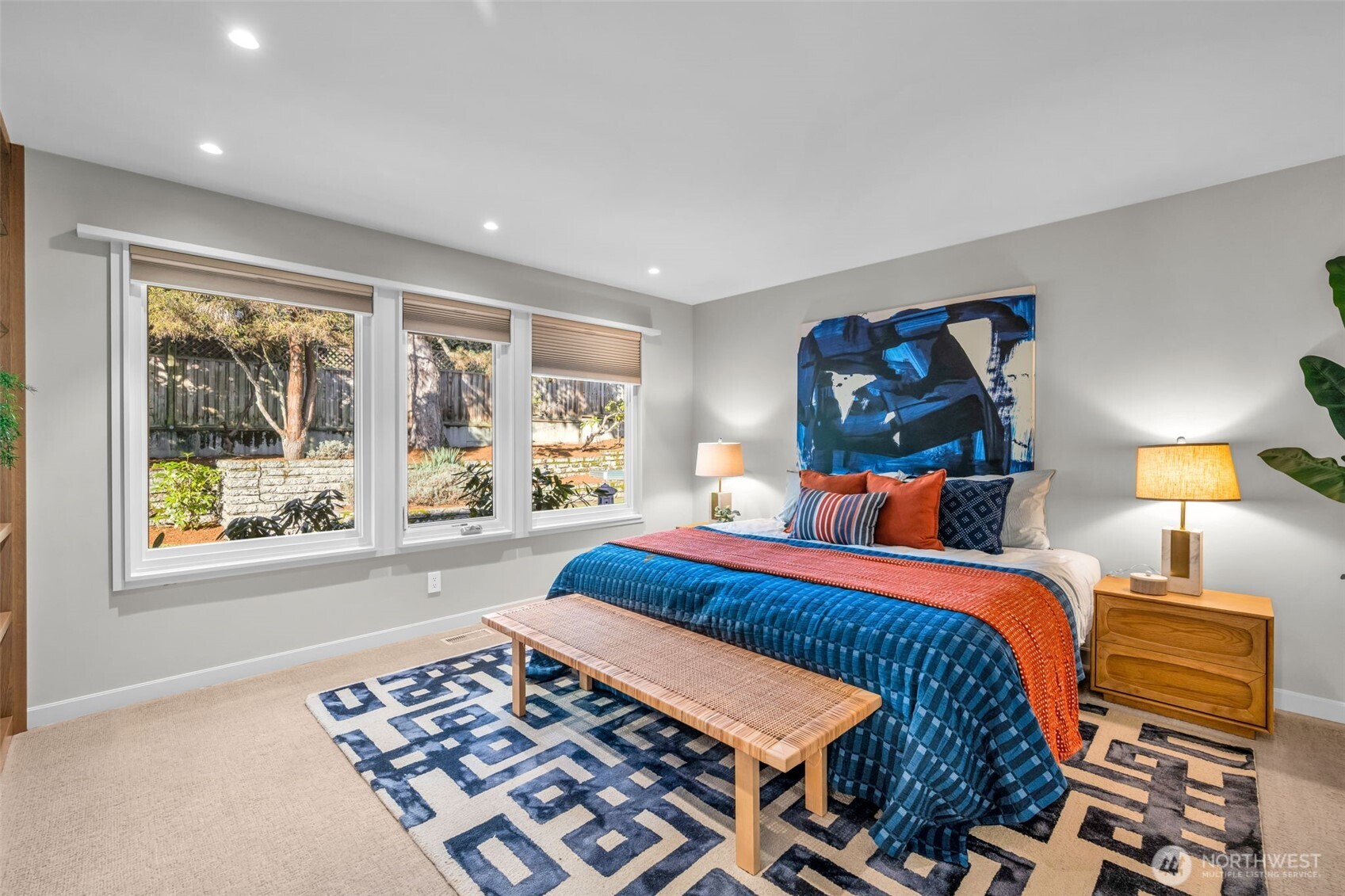 6437 Hampton Road South Seattle, WA 98118 - Photo 26 of 39 a bedroom with a bed and a lamp on dresser